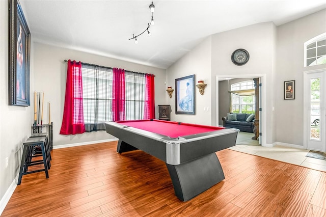 8814 N River Rd, Tampa, FL 33635 - recreation room with baseboards, wood finished floors, pool table, and high vaulted ceiling