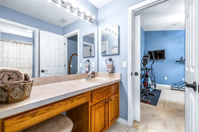8814 N River Rd, Tampa, FL 33635 - bathroom featuring vanity and baseboards
