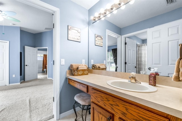8814 N River Rd, Tampa, FL 33635 - bathroom with a ceiling fan, vanity, and baseboards