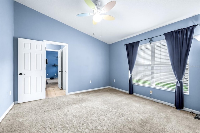 8814 N River Rd, Tampa, FL 33635 - carpeted spare room with lofted ceiling, baseboards, and a ceiling fan