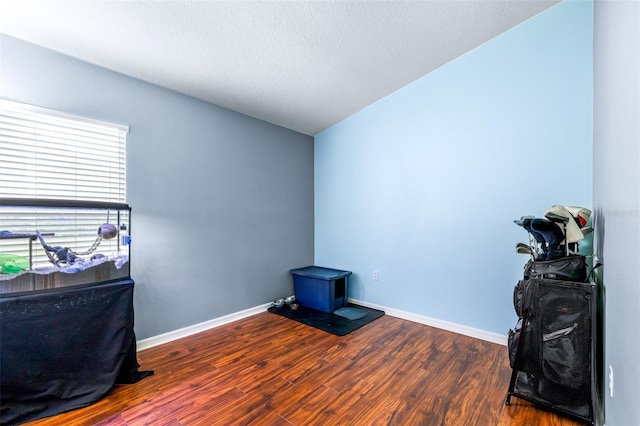 8814 N River Rd, Tampa, FL 33635 - misc room with wood finished floors and baseboards