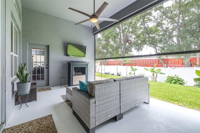 8814 N River Rd, Tampa, FL 33635 - view of patio / terrace featuring an outdoor living space with a fireplace and a ceiling fan