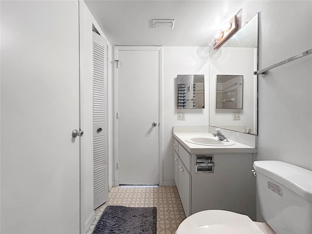 650 Island Way Unit 408, Clearwater Beach, FL 33767 - bathroom with a closet, vanity, and tile patterned floors