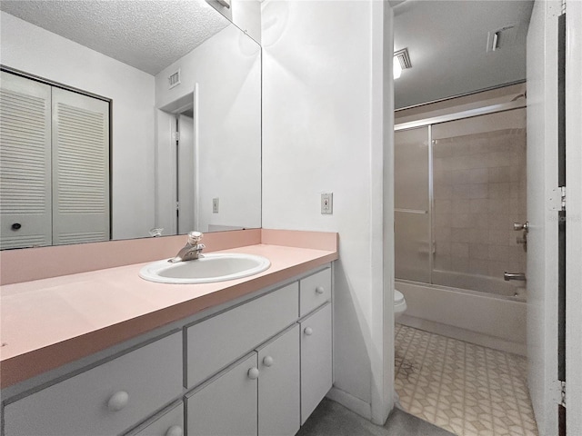 650 Island Way Unit 408, Clearwater Beach, FL 33767 - full bath featuring vanity, tile patterned floors, shower / bath combination with glass door, and a textured ceiling
