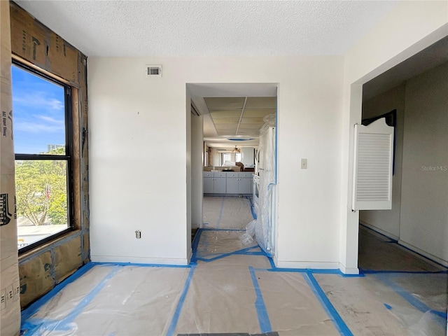 650 Island Way Unit 408, Clearwater Beach, FL 33767 - interior space featuring baseboards and a textured ceiling