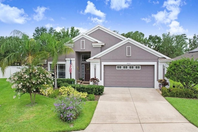 5013 119th Ter E, Parrish, FL 34219 - view of front facade featuring an attached garage, stucco siding, and driveway