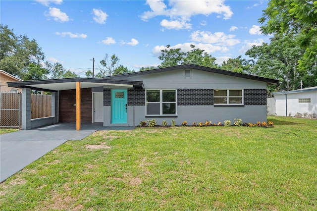 4841 Drift Tide Dr, New Port Richey, FL 34652 - single story home with concrete driveway and a carport