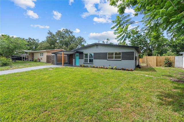4841 Drift Tide Dr, New Port Richey, FL 34652 - view of front of house with a carport and concrete driveway