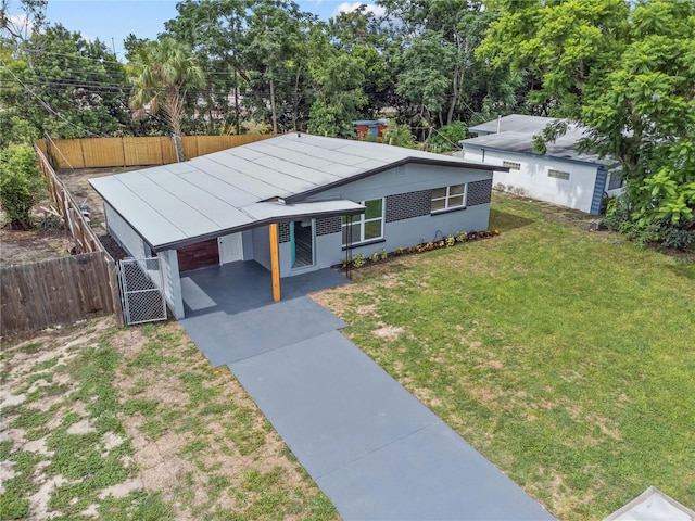 4841 Drift Tide Dr, New Port Richey, FL 34652 - view of front of house with driveway and an attached carport