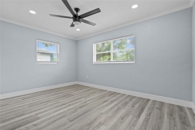 4841 Drift Tide Dr, New Port Richey, FL 34652 - empty room featuring plenty of natural light, ornamental molding, a ceiling fan, recessed lighting, and light wood-style flooring