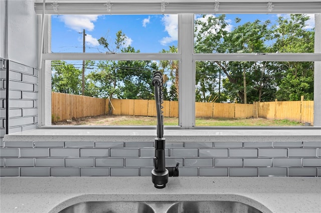 4841 Drift Tide Dr, New Port Richey, FL 34652 - kitchen view of decorative backsplash and light stone counters