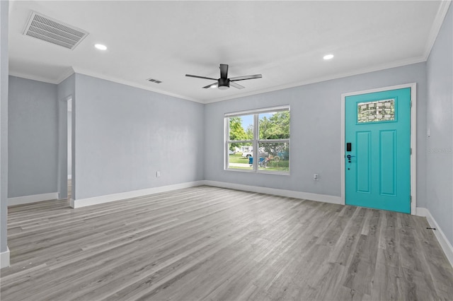 4841 Drift Tide Dr, New Port Richey, FL 34652 - unfurnished living room featuring ornamental molding, ceiling fan, light wood-style floors, and recessed lighting