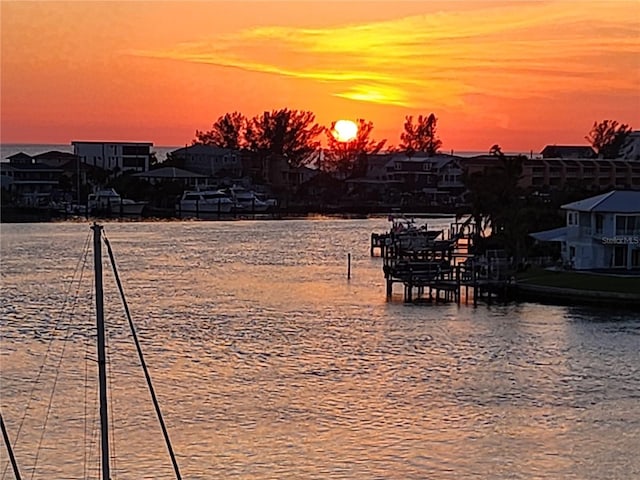 9525 Blind Pass Rd Unit 505, St Pete Beach, FL 33706 - water view with a boat dock and nearby suburban area