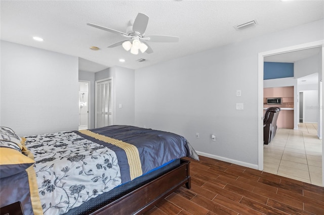 10446 Baylor Dr, Spring Hill, FL 34608 - bedroom featuring recessed lighting, baseboards, wood finished floors, and a ceiling fan