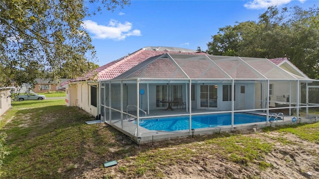 10446 Baylor Dr, Spring Hill, FL 34608 - back of house featuring a tile roof, an outdoor pool, a patio area, and a lanai