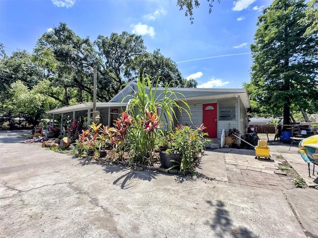 14210 Downing St, Dover, FL 33527 - view of front of house featuring a patio