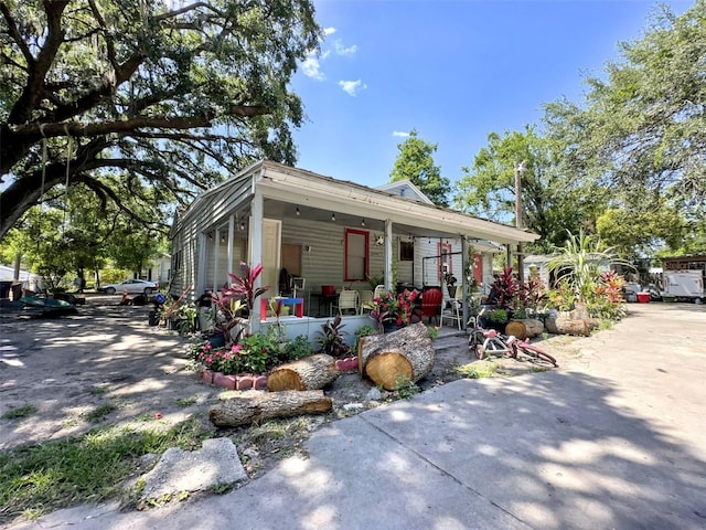 14210 Downing St, Dover, FL 33527 - view of property exterior with covered porch