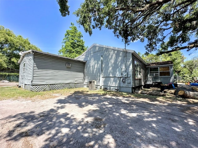 14210 Downing St, Dover, FL 33527 - view of home's exterior featuring crawl space