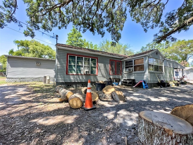 14210 Downing St, Dover, FL 33527 - view of front facade featuring central AC unit and crawl space