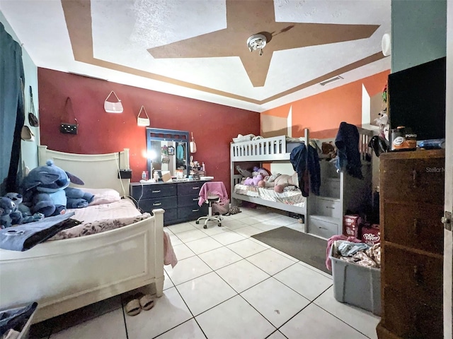 14210 Downing St, Dover, FL 33527 - bedroom featuring light tile patterned flooring and a raised ceiling