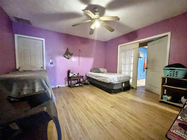 14210 Downing St, Dover, FL 33527 - bedroom with wood finished floors and ceiling fan