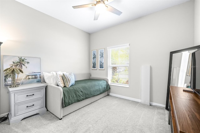 30762 Parrot Reef Ct, Wesley Chapel, FL 33545 - bedroom featuring light carpet, baseboards, and ceiling fan