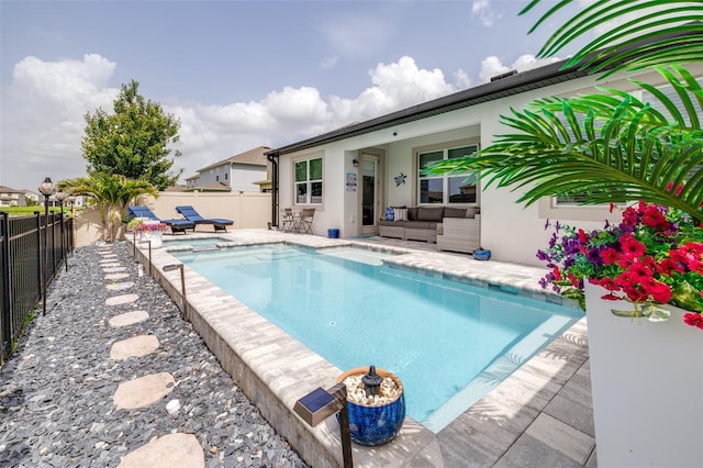 30762 Parrot Reef Ct, Wesley Chapel, FL 33545 - view of swimming pool featuring an outdoor hangout area, a fenced backyard, a patio area, and a pool with connected hot tub
