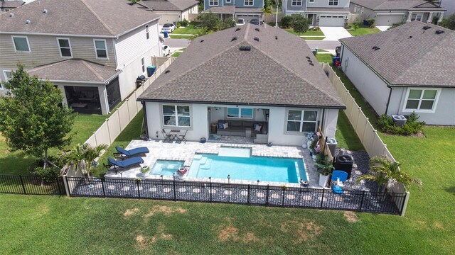 30762 Parrot Reef Ct, Wesley Chapel, FL 33545 - rear view of house with a residential view, stucco siding, a patio, roof with shingles, and outdoor lounge area