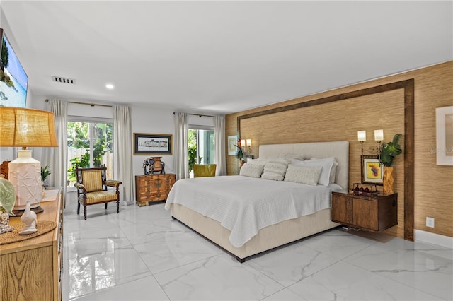 208 Live Oak Ln, Largo, FL 33770 - bedroom with light marble finish floors, recessed lighting, and access to outside