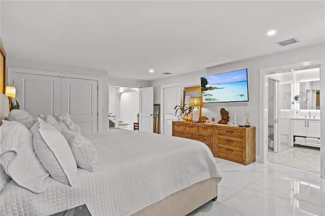 208 Live Oak Ln, Largo, FL 33770 - bedroom with recessed lighting, light marble finish floors, and ensuite bath