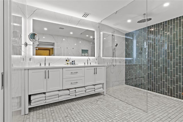 208 Live Oak Ln, Largo, FL 33770 - full bathroom with double vanity, a marble finish shower, recessed lighting, tile patterned floors, and tile walls