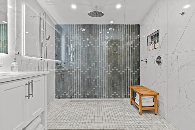 208 Live Oak Ln, Largo, FL 33770 - bathroom featuring tile walls, vanity, a walk in shower, recessed lighting, and tile patterned flooring