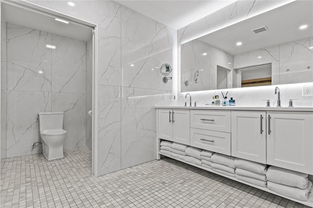 208 Live Oak Ln, Largo, FL 33770 - full bathroom featuring tile walls, double vanity, and tile patterned floors