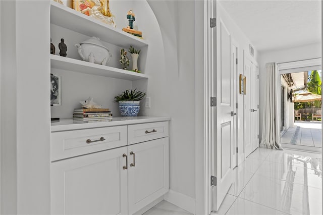 208 Live Oak Ln, Largo, FL 33770 - hall with light marble finish flooring and baseboards