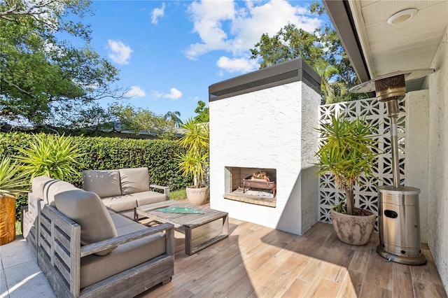 208 Live Oak Ln, Largo, FL 33770 - view of patio / terrace with an outdoor living space with a fireplace