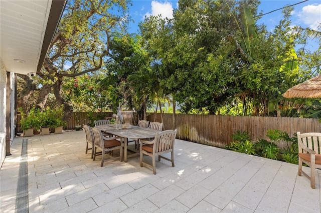 208 Live Oak Ln, Largo, FL 33770 - fenced backyard with a patio and outdoor dining space