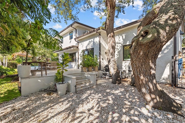 208 Live Oak Ln, Largo, FL 33770 - view of front of house featuring stucco siding and a patio