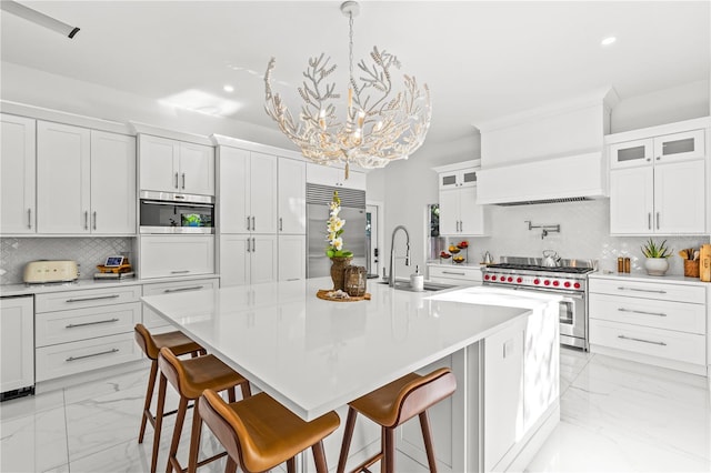 208 Live Oak Ln, Largo, FL 33770 - kitchen featuring premium appliances, light marble finish floors, tasteful backsplash, a chandelier, and glass insert cabinets