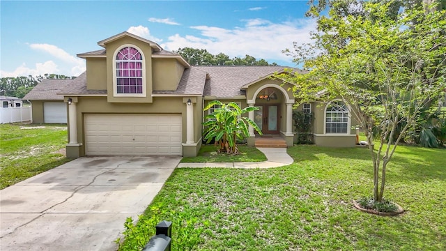 1332 Osceola Hollow Rd, Odessa, FL 33556 - view of front of home featuring stucco siding, a front lawn, concrete driveway, and roof with shingles