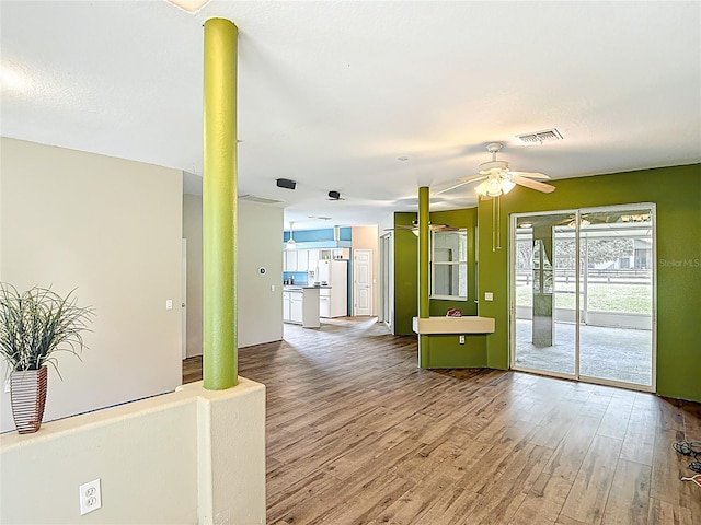 1332 Osceola Hollow Rd, Odessa, FL 33556 - empty room with wood finished floors and ceiling fan