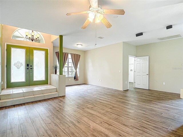 1332 Osceola Hollow Rd, Odessa, FL 33556 - entrance foyer with wood finished floors, french doors, a chandelier, and a ceiling fan
