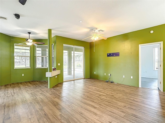 1332 Osceola Hollow Rd, Odessa, FL 33556 - unfurnished room featuring a ceiling fan and light wood finished floors