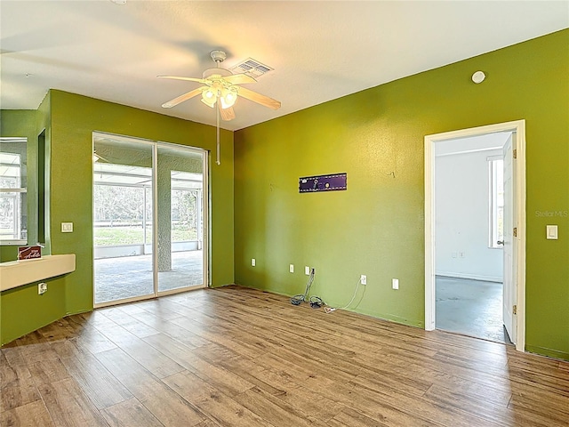 1332 Osceola Hollow Rd, Odessa, FL 33556 - unfurnished room with a ceiling fan and wood finished floors