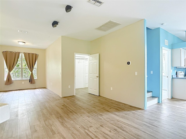1332 Osceola Hollow Rd, Odessa, FL 33556 - spare room with light wood finished floors and stairway