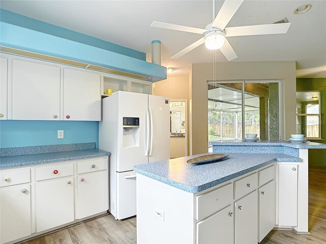 1332 Osceola Hollow Rd, Odessa, FL 33556 - kitchen with white refrigerator with ice dispenser, light wood finished floors, light countertops, and ceiling fan