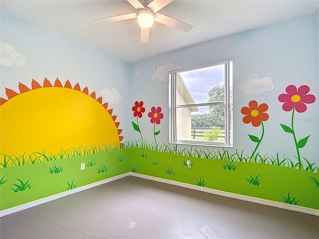 1332 Osceola Hollow Rd, Odessa, FL 33556 - spare room with concrete flooring, a ceiling fan, and baseboards
