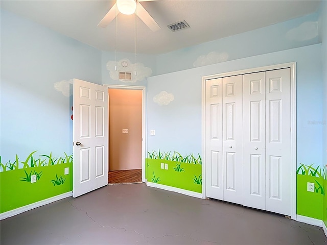 1332 Osceola Hollow Rd, Odessa, FL 33556 - unfurnished bedroom featuring baseboards, finished concrete flooring, a closet, and ceiling fan