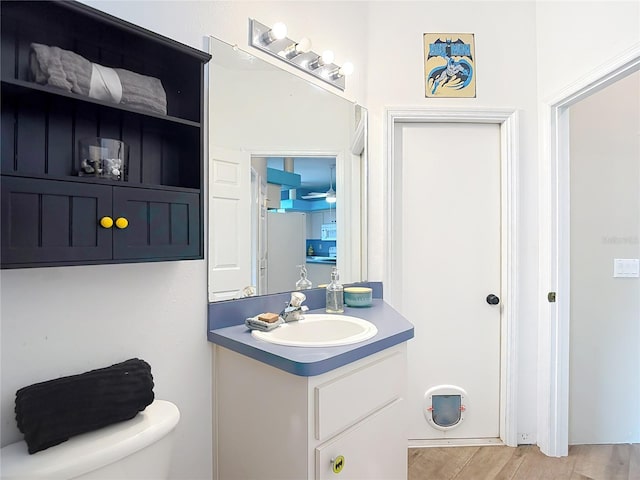 1332 Osceola Hollow Rd, Odessa, FL 33556 - bathroom with vanity, toilet, and wood finished floors