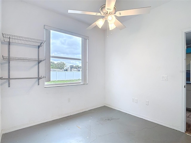 1332 Osceola Hollow Rd, Odessa, FL 33556 - unfurnished bedroom with concrete flooring, baseboards, and ceiling fan