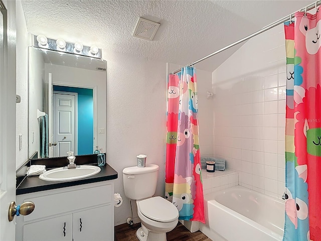 1332 Osceola Hollow Rd, Odessa, FL 33556 - full bathroom featuring vanity, shower / bathtub combination with curtain, toilet, a textured ceiling, and wood finished floors